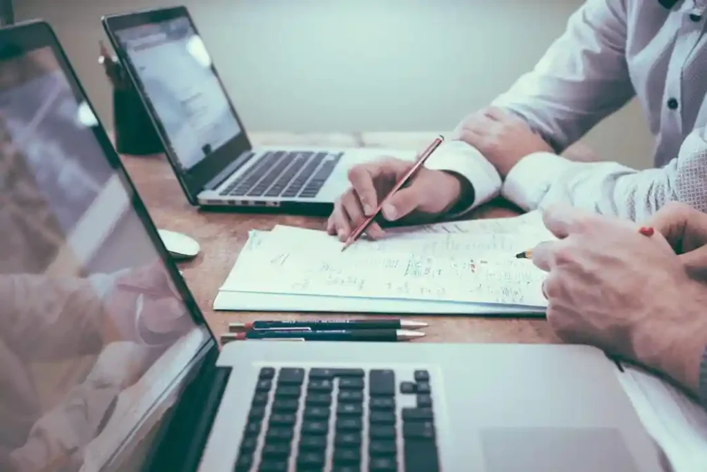 Two business professionals work on an account planning strategy.